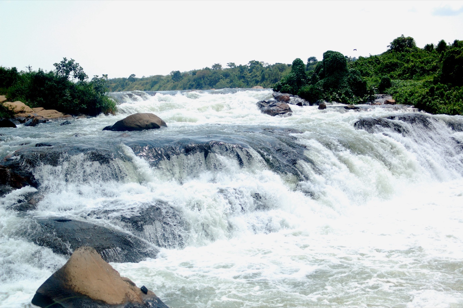 Rafters tackling Grade 5 Nile rapids, Uganda