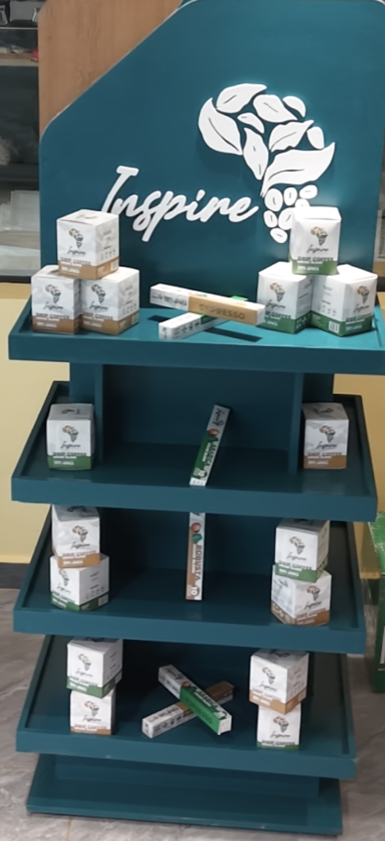Inspire Africa drip coffee packs arranged on a shelf