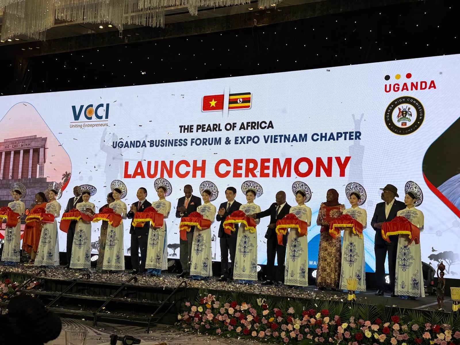 The launch ceremony of the Pearl of Africa Uganda Business Forum & Expo, Vietnam Chapter, on stage in Hanoi.